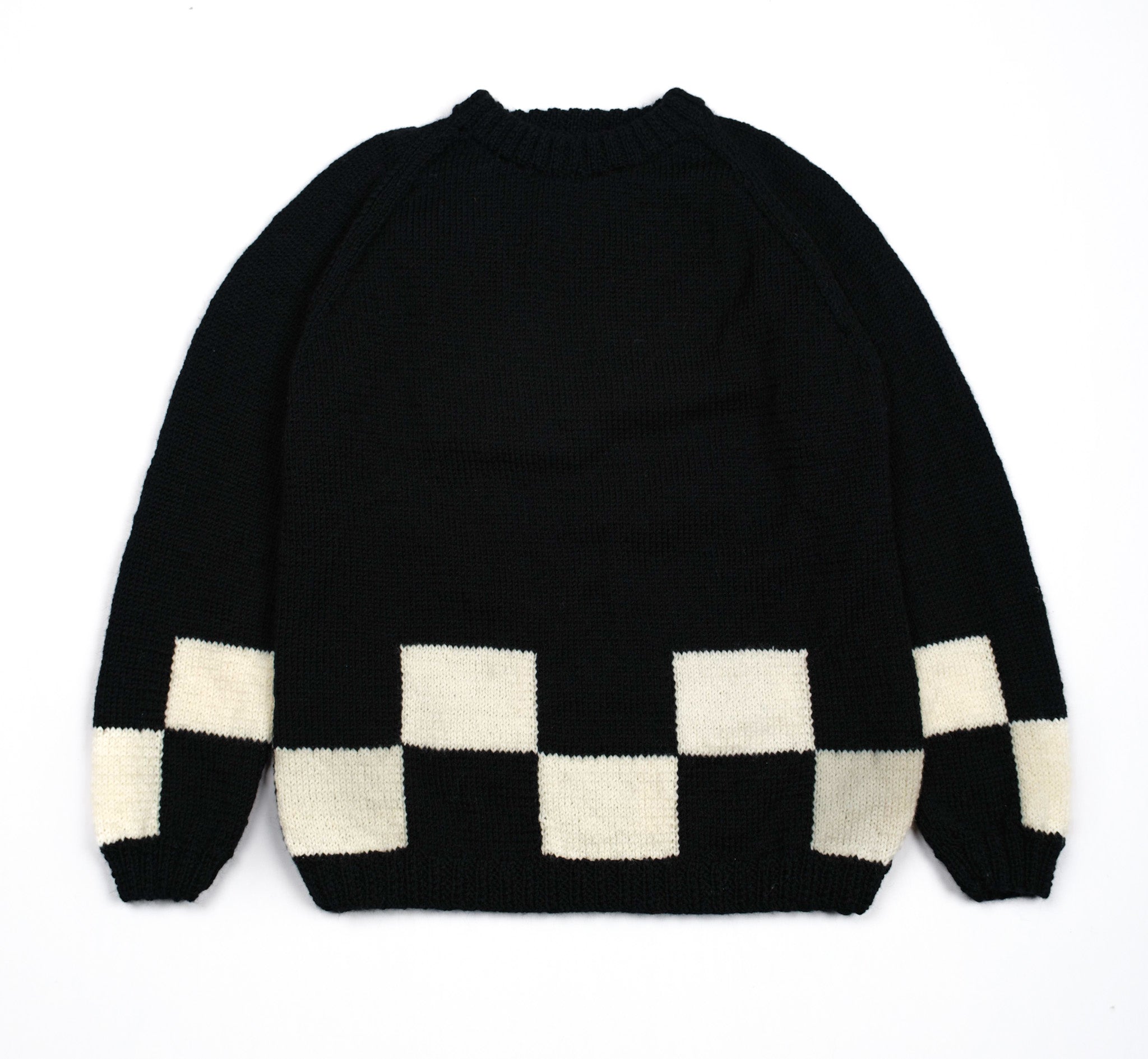 Pure Wool checkered jumper. Beige and black in colour, hand knitted and large fit.