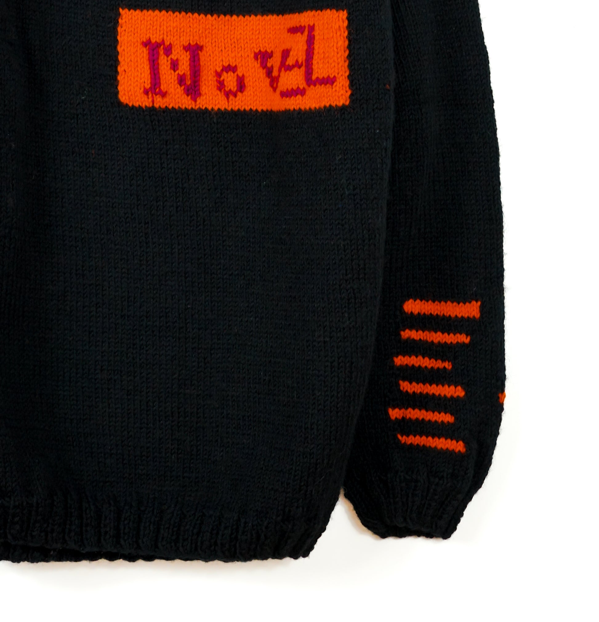 Pure Wool Black Jumper with orange patterns over the sleeves, one off and hand knitted