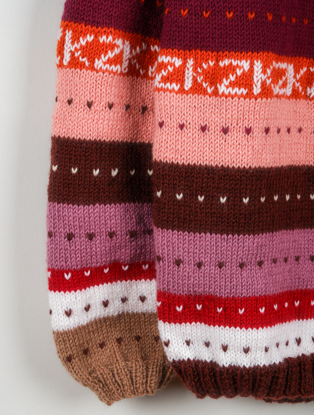 Pure Wool Pink heavy jumper with multicolours and patterns. Hand knitted and medium to large fit.